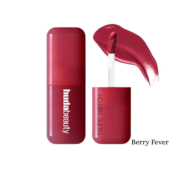 Huda Beauty liquid blush in Berry Fever shade, berry red tube with applicator.