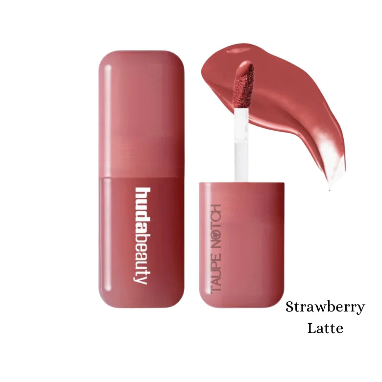 Huda Beauty liquid blush in Strawberry Latte shade, mauve-pink tube with applicator.