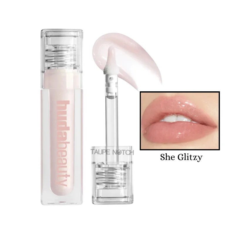 Light blush pink extra-shine lip gloss in clear tube with doe-foot applicator.