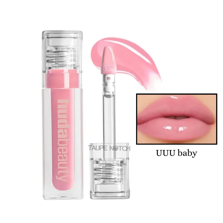 Soft baby pink extra-shine lip gloss in clear tube with doe-foot applicator.