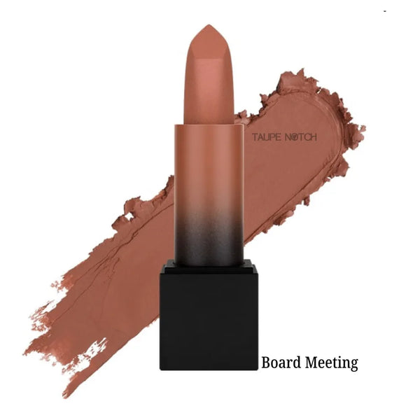 Matte lipstick bullet with caramel brown shade on lip swatch, “Board Meeting” label