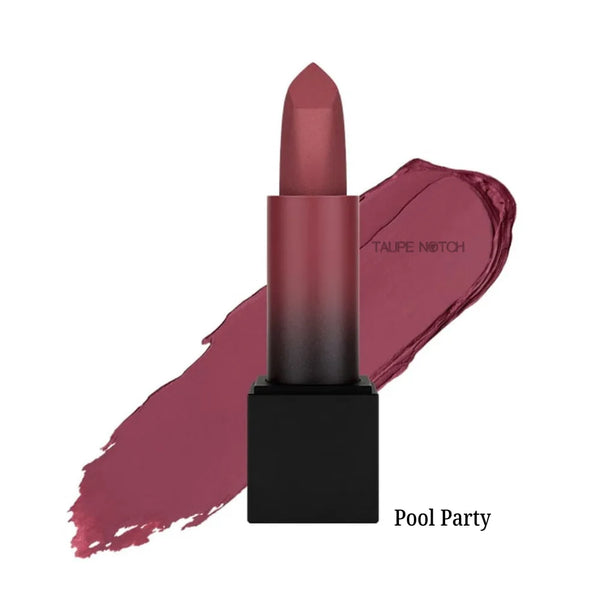 Matte lipstick bullet with deep berry-pink shade on lip swatch, “Pool Party” label