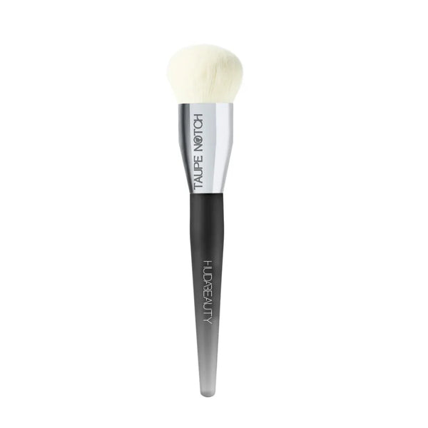 Huda Beauty mini base brush with white bristles and dark handle