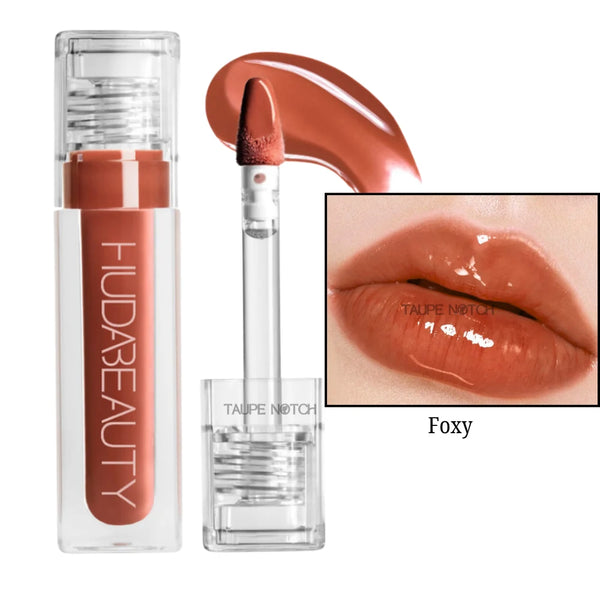 Foxy lip gloss in warm reddish-brown with clear tube and doe-foot applicator
