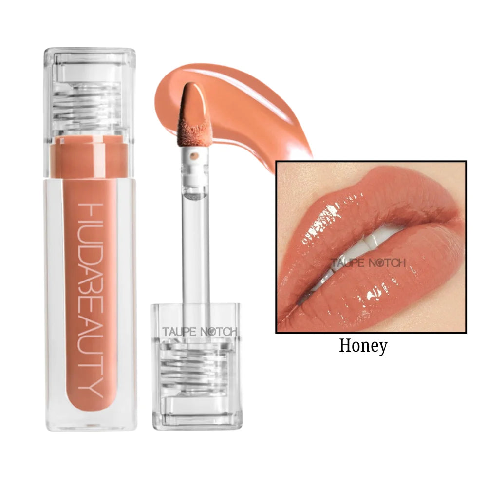 Honey lip gloss in warm honey-orange with clear tube and doe-foot applicator