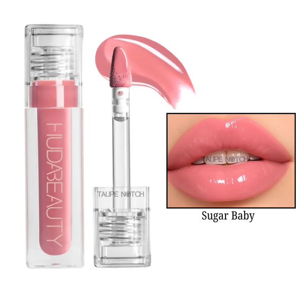 Sugar Baby lip gloss in bright pink with clear tube and doe-foot applicator