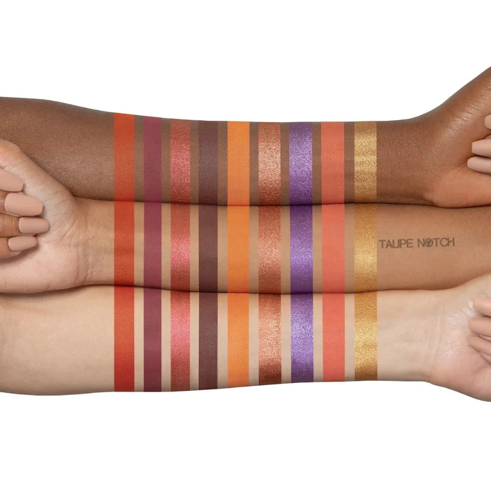 Eyeshadow swatches on forearms: red, orange, purple, pink, bronze and gold glitter shades