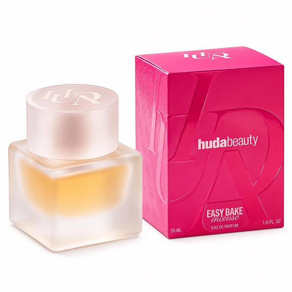 Huda Beauty Easy Bake Intense Eau de Parfum 50ml bottle next to its bright pink packaging box on a white background.