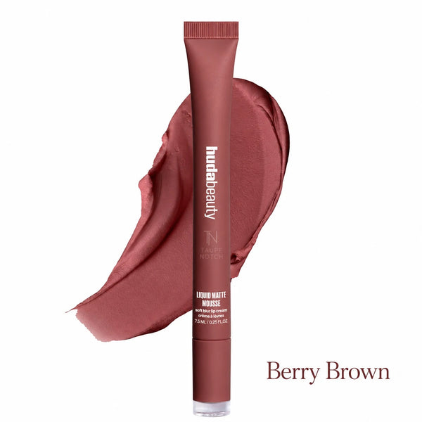 A tube of Fundabeauty Liquid Matte Bronzer in the shade Berry Brown, shown vertically in front of a matching cream-colored makeup smear on a white background.