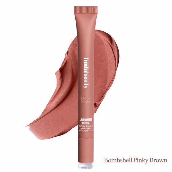 A tube of hudabeauty Tallow Note Liquid Matte Mousse in the shade Bombshell Pinky Brown, shown upright in front of a matching pinkish-brown makeup smear on a white background.