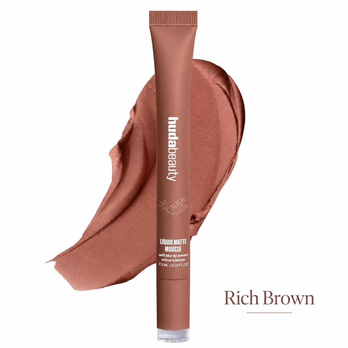 A tube of hudabeauty Liquid Matte Mousse in the shade Rich Brown, shown vertically in front of a matching liquid makeup smear on a white background.
