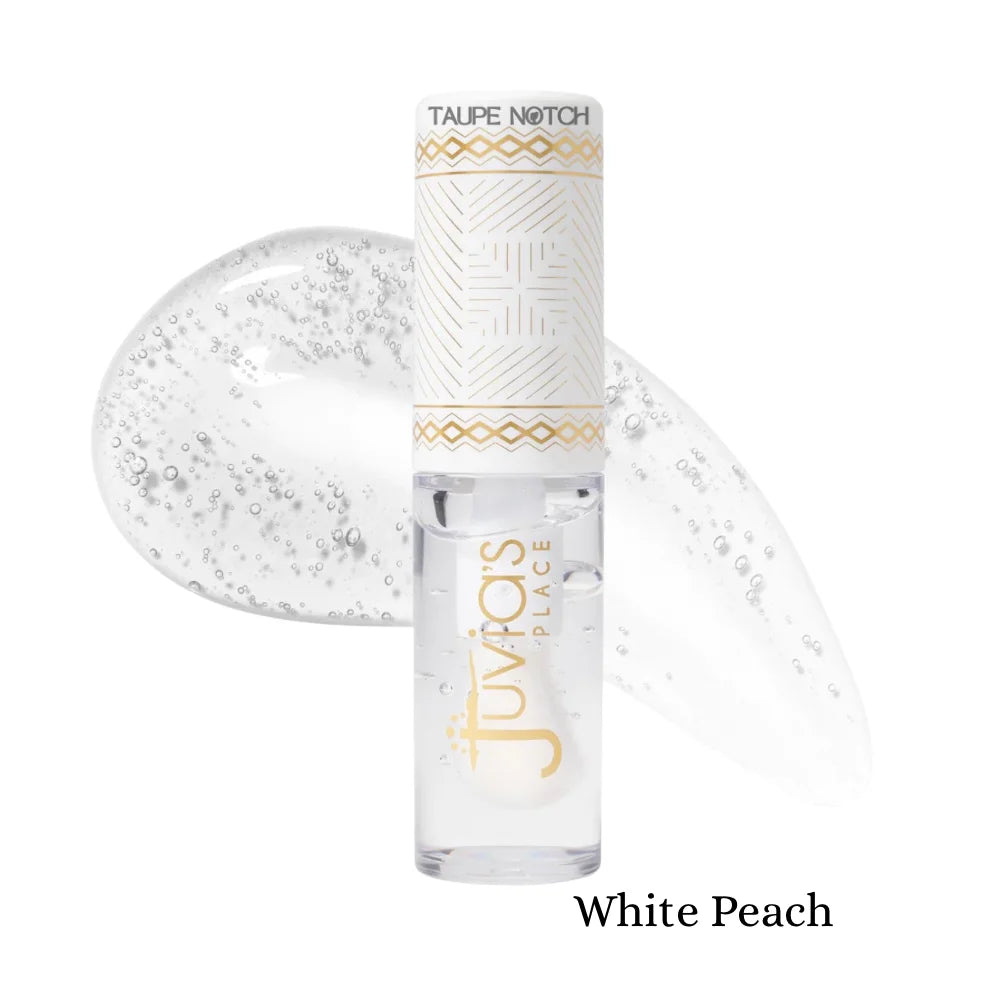 Magic lip oil in White Peach shade, clear glossy tube with applicator tip