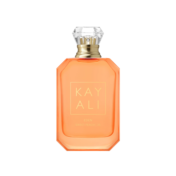 KAY ALI Eden Sweet Peach 5% fragrance bottle in a vibrant orange color, featuring a faceted clear crystal cap and gold lettering on a white background.