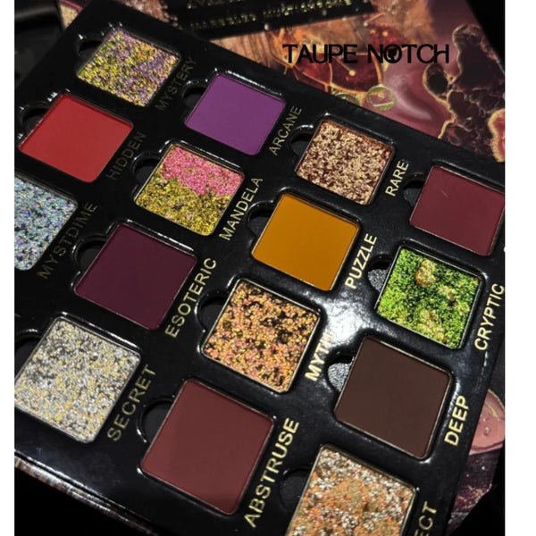 Magnetic eyeshadow palette close-up with multi-chrome purple, gold, red and green pans