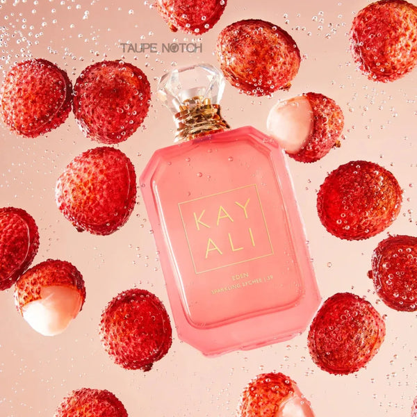Kayali Eden Sparkling Lychee eau de parfum bottle with lychees and spritz bubbles