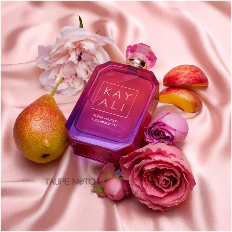 KAYALI eau de parfum bottle, angled view, pink glass with gold cap