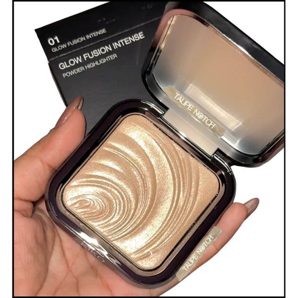 Champagne highlighter compact open, showing shimmery cream-gold powder in pan