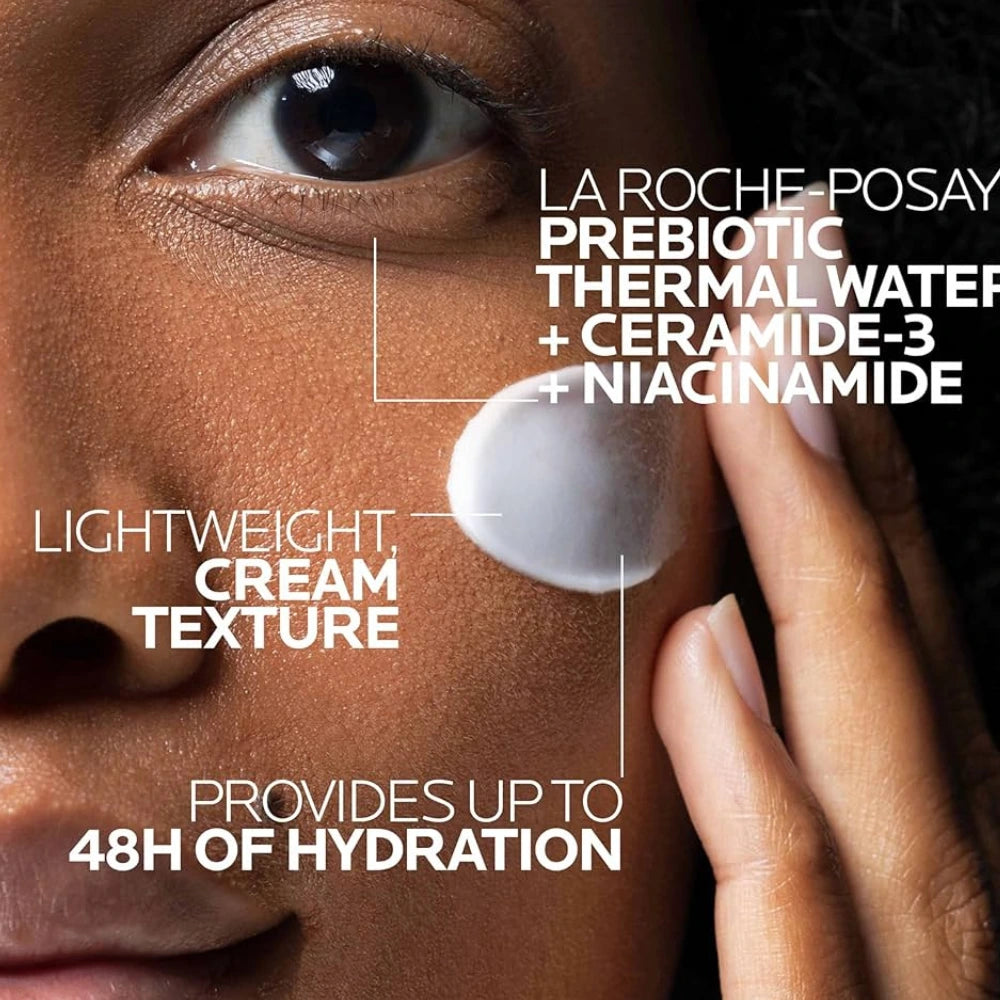 Face moisturizer being smoothed over skin with cream drop on finger