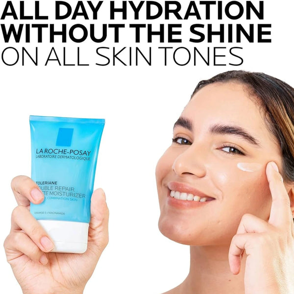 Matte moisturizer tube held near face on smiling person