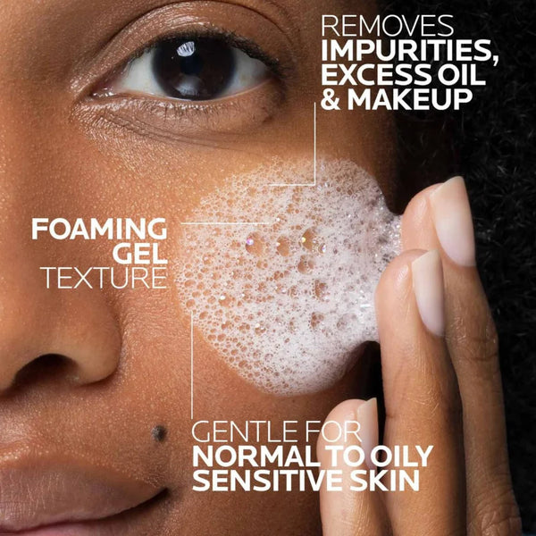 Foaming gel on face near eye with finger pressing cleanser texture