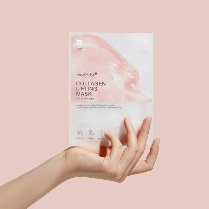 MEDICUBE Collagen Lifting Mask 27g packaging held by a hand on a pink background