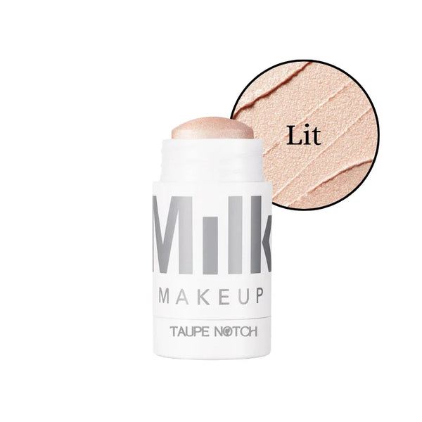 Milk Makeup dewy cream highlighter stick in Lit, light rose-gold cream