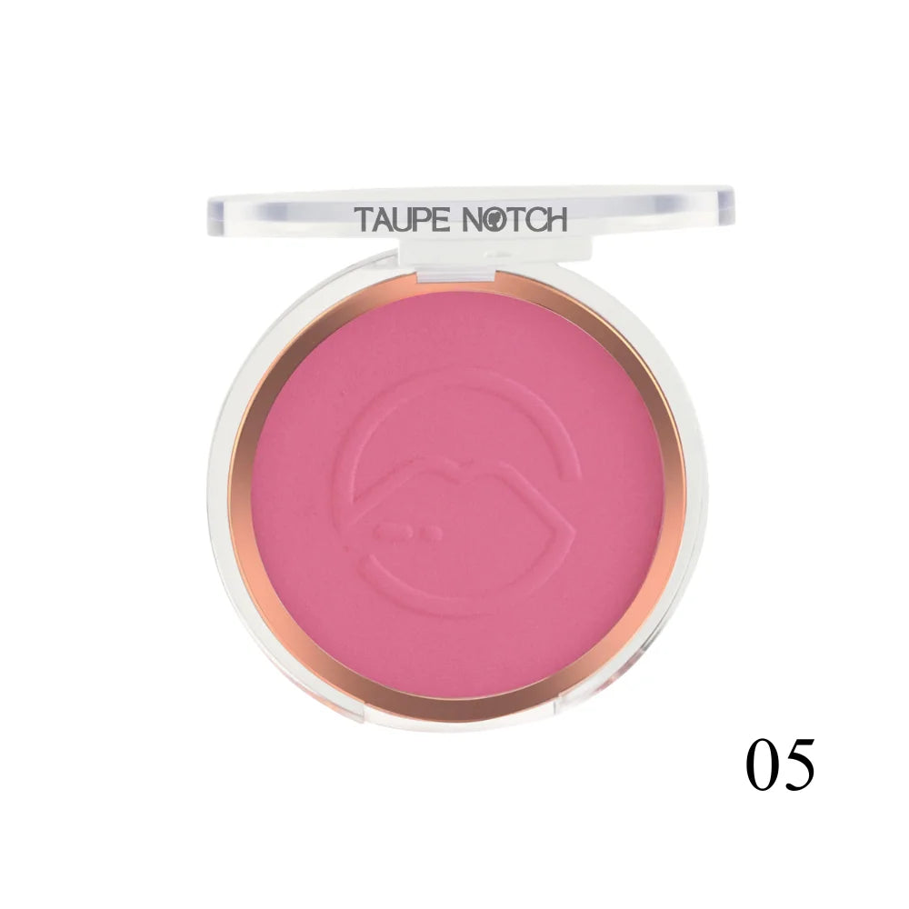 Pressed face blusher compact, bright fuchsia-pink powder shade 05 with embossed heart logo.