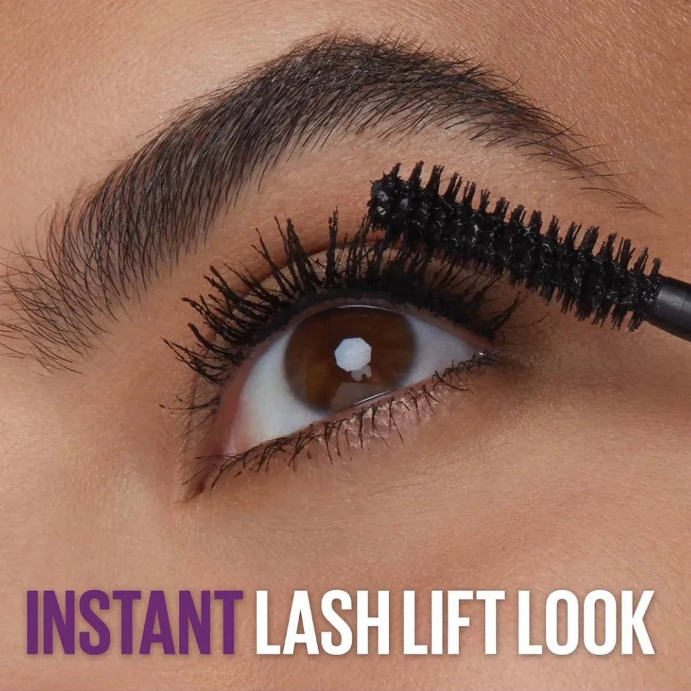 Eye with curled lashes coated in black mascara, instant lash lift look