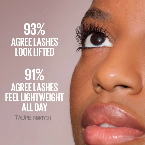 Close-up eye with mascara-coated curled lashes and defined upper lash line.