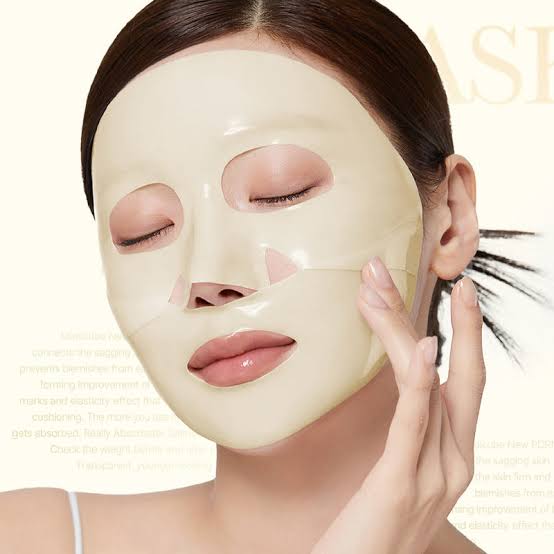 Woman wearing  Medicube Kojic Acid Turmeric Brightening Gel Mask – mask with a blurred background