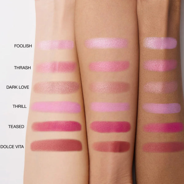 Six blush shade swatches on skin, from pale pink to magenta and warm rose