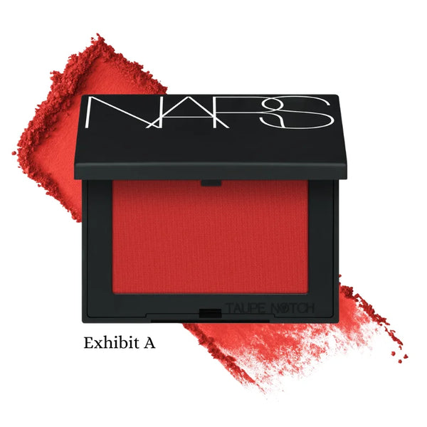 Powder blush compact, Exhibit A shade deep red powder in NARS case.