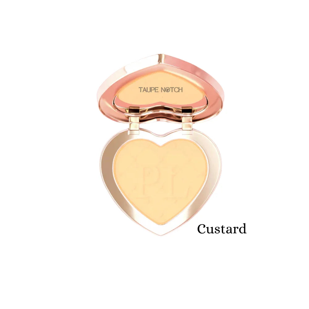 Under-eye brightening powder compact, Custard shade, heart pan with light yellow powder.