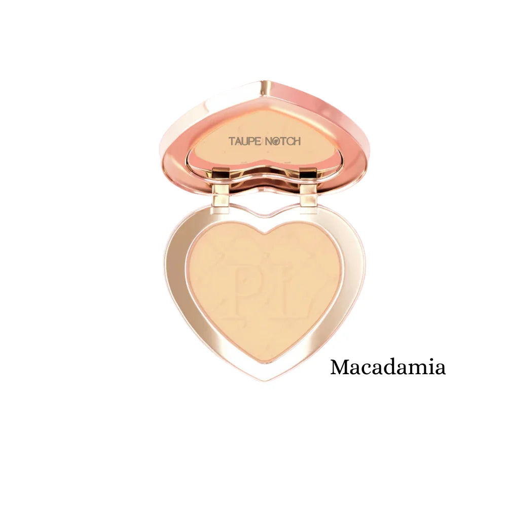 Under-eye brightening powder compact, Macadamia shade, heart pan with light tan powder.