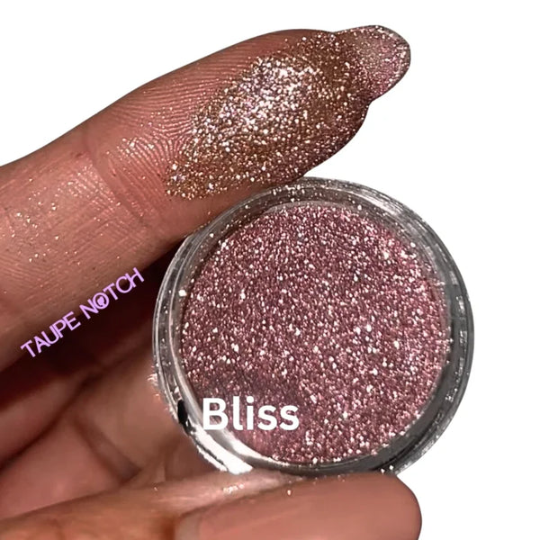 Taupe starry glitter nail polish in small round jar, glittery mauve-pink shade