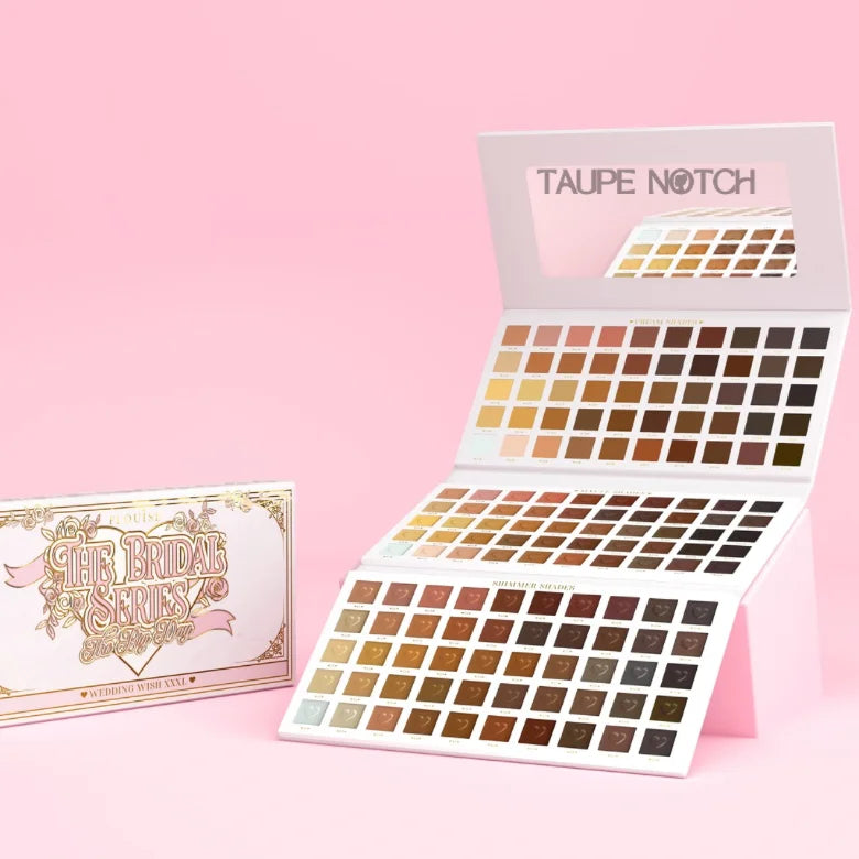 Wedding makeup palette with open lid and many square eyeshadow pans in a grid