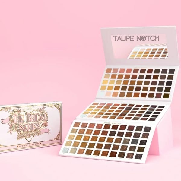 Wedding makeup palette with open lid and many square eyeshadow pans in a grid