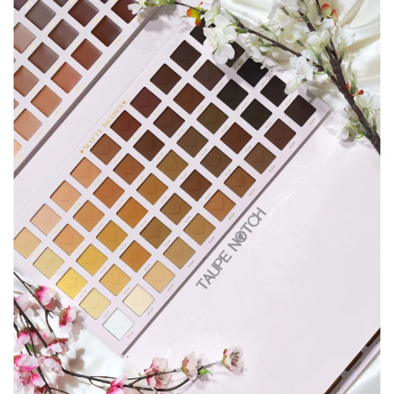 Makeup eyeshadow palette with rows of square pans in warm tan, brown, and dark tones