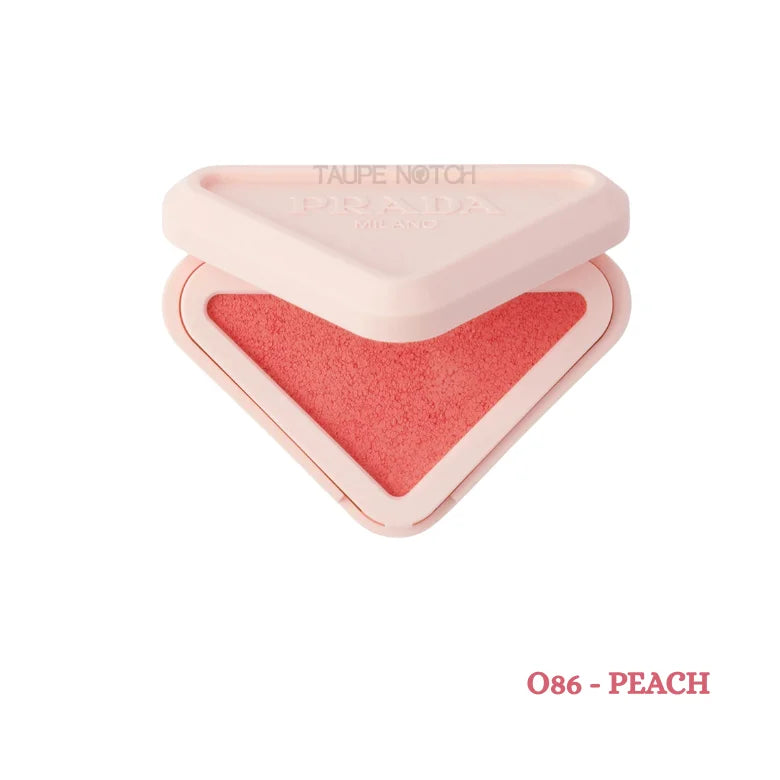 Prada Milano Blush Refillable Powder Blush in O86 Peach open triangle compact showing warm coral peach shade