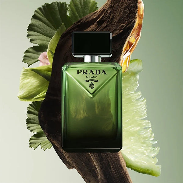 Prada Paradigme eau de parfum bottle with green glass, black cap, and silver collar