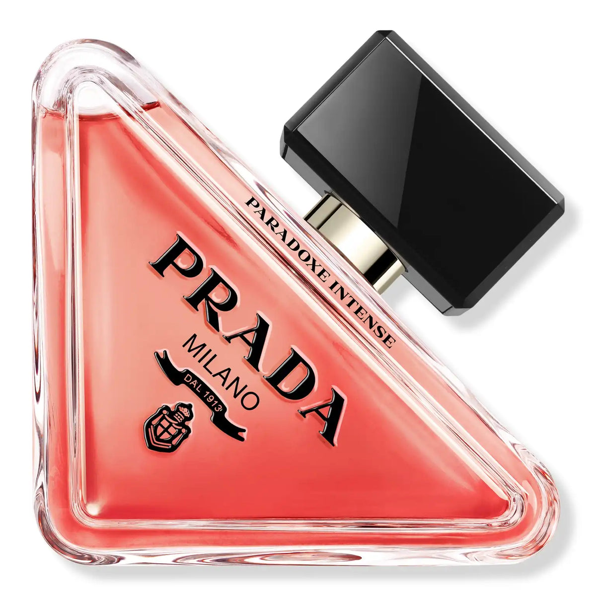 Close-up triangular red-pink eau de parfum bottle with black cap and PRADA text