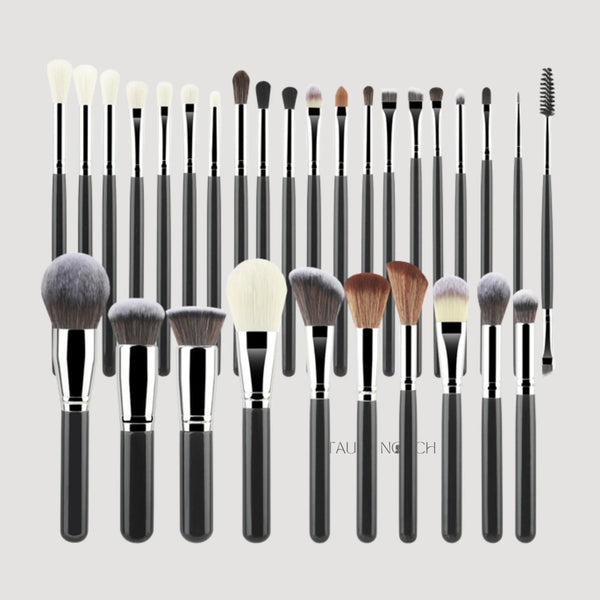 Shein makeup brush set with assorted black and white handles, silver ferrules, fluffy bristles.
