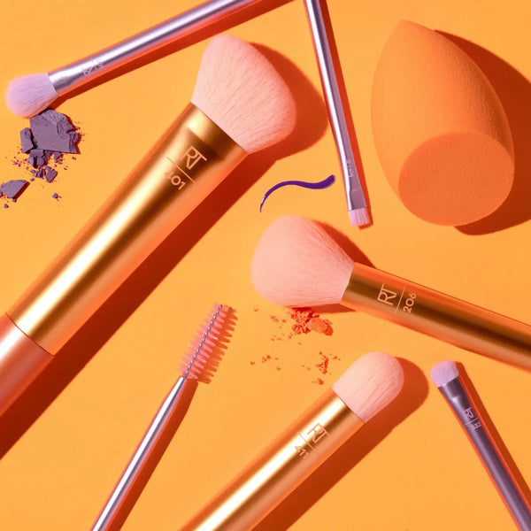 Real Techniques brush and sponge set, orange sponge and metallic-handled face brushes