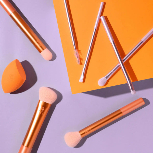 Makeup brush and sponge set, orange sponge with several metallic-handled brushes