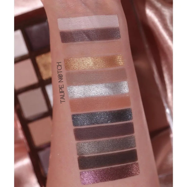 Eye shadow swatches on skin: taupe, gold, pale pink, light gray, dark brown, and purple