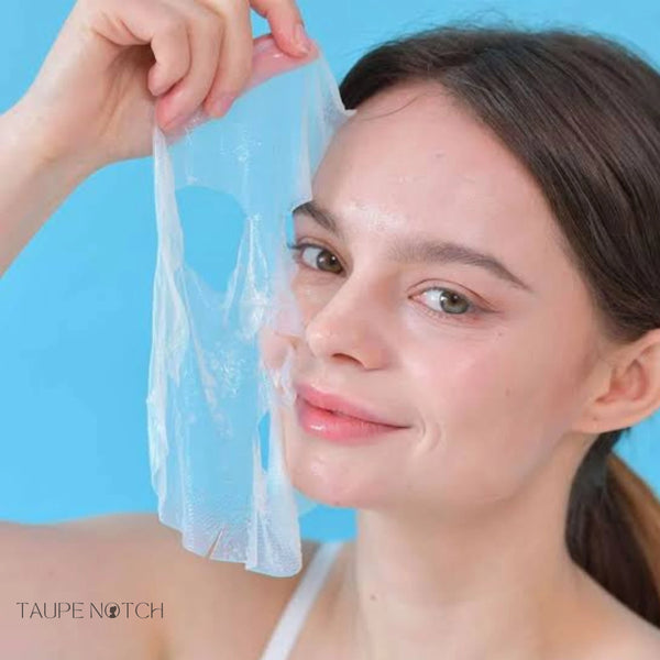 Translucent sheet mask with water gel, held up to face near cheek