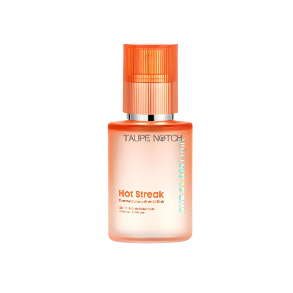 Orange hair oil elixir bottle with ribbed orange cap and silver collar