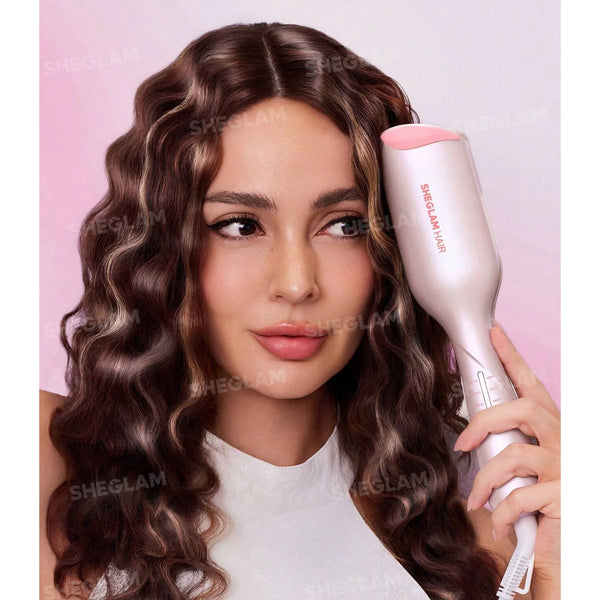 Pink and rose-gold 25mm hair waver held in hand