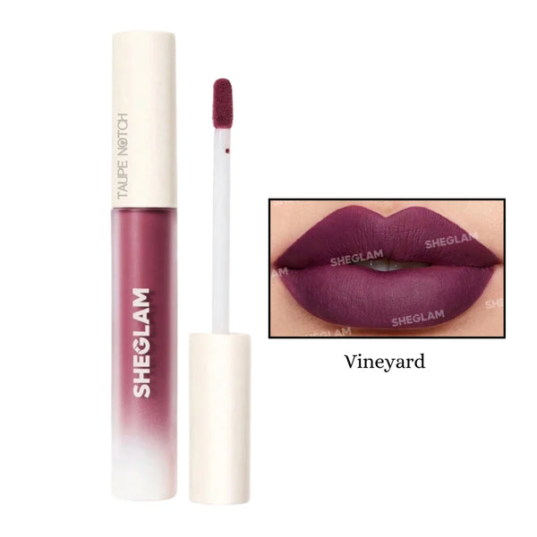 Matte liquid lipstick in wine plum tube with doe-foot applicator and lip swatch