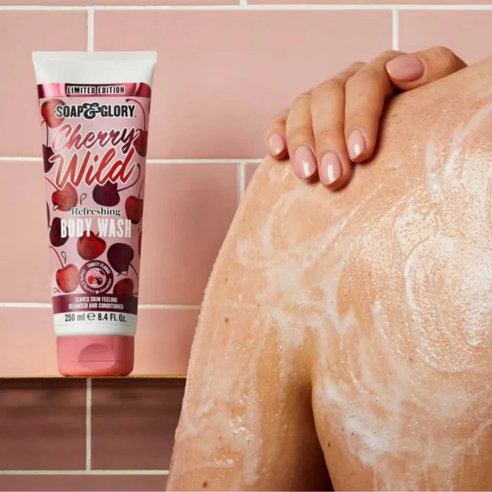 Body wash foam on leg with bottle nearby